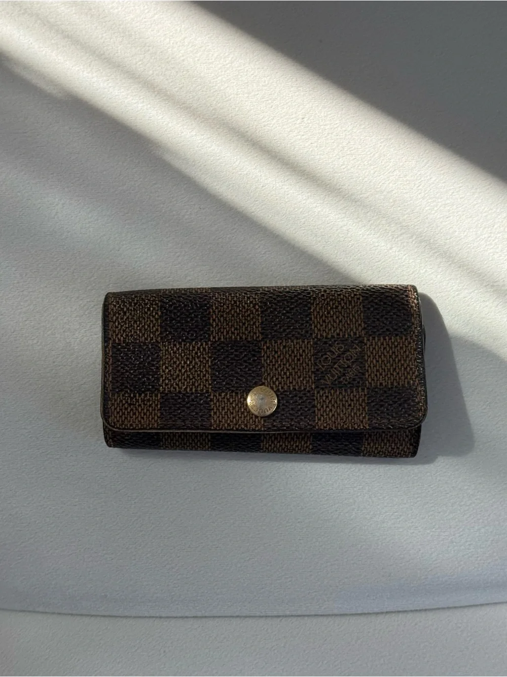 SOLD Louis Vuitton Brown Damier Ebene Canvas Key Pouch with Gold Button
